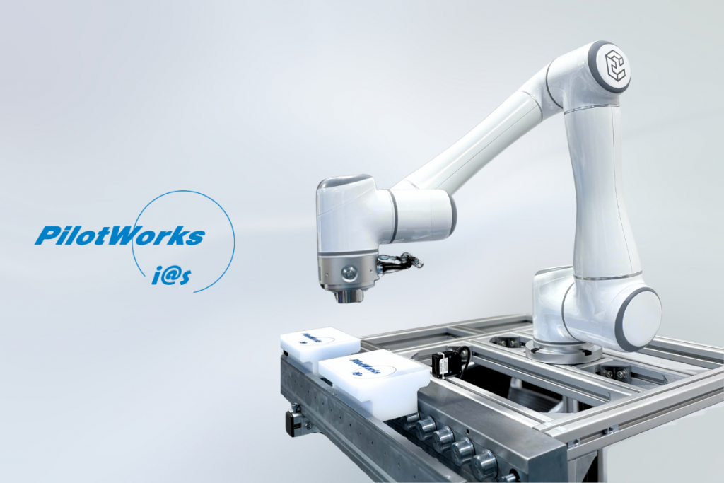 Collaborative robot (cobot) deployed by PilotWorks on a smart production line, picking components safely and precisely.