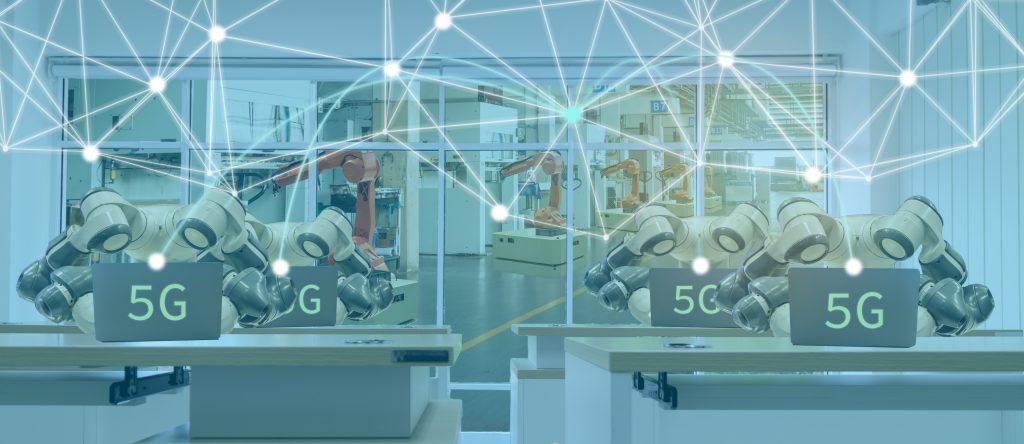 5G-enabled robotic arms operating in a modern smart factory with digital network overlay.