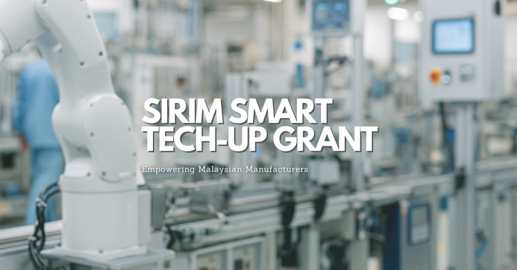 Smart factory with robotic arms and engineers operating automation systems, symbolizing Malaysia’s Industry 4.0 transformation under the SIRIM Smart Tech-Up Grant.